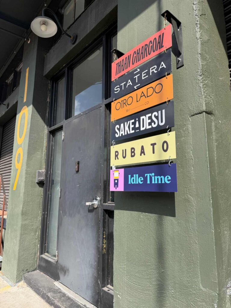 Idle Time wine lounge front door of 109 SE Salmon with signage